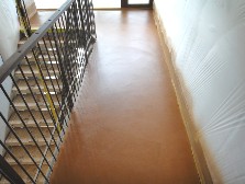 Hard concrete surfaces with colour pigmentation in terracotta